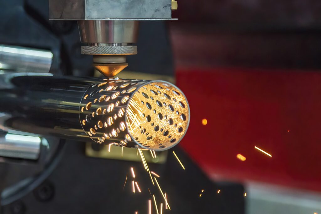 tube laser cutting holes into a round surface