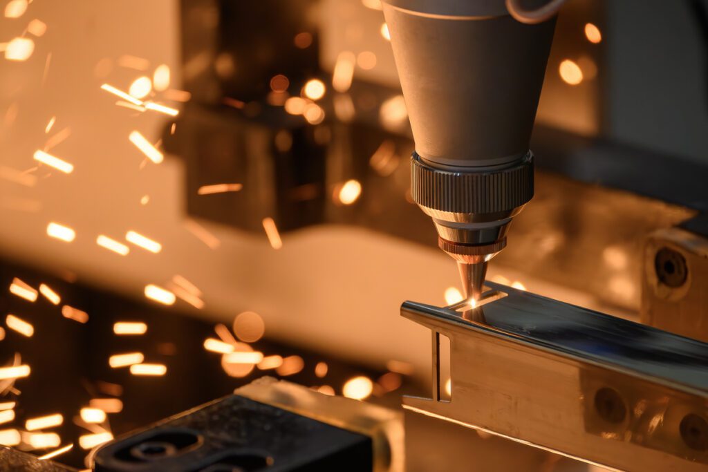 Close up scene the fiber laser cutting machine working with the square shape stainless steel tube.